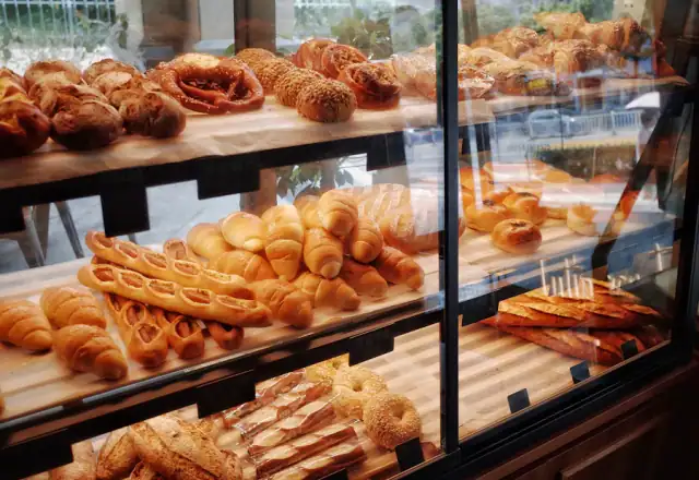 Breads on a display shelf in a bakery for commercial kitchen rental in ohio