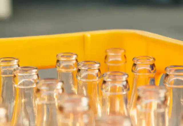 Clear glass labeled bottles for kitchen rental for packaged snack brands