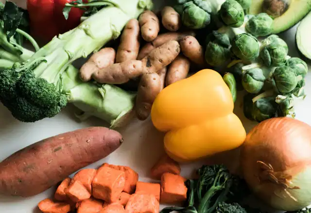Assorted fresh vegetables including broccoli and peppers for kitchen rental for plant-based brands
