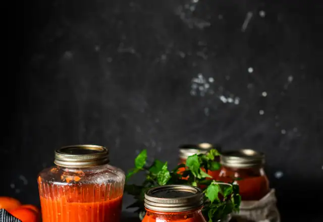 Clear glass jars on a wooden table for food packaging area