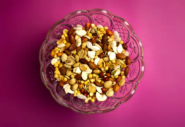 Nuts in a clear glass bowl for food packaging area