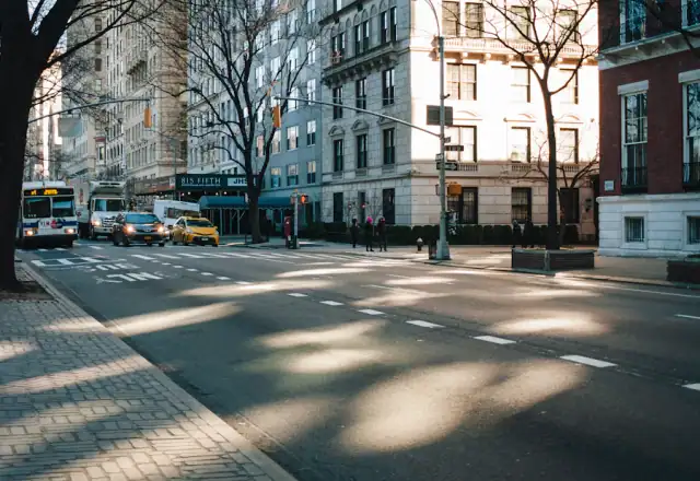 City street lined with tall buildings for kitchen rental states and areas