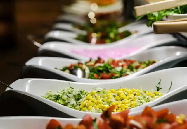 Table full of plates of catered food for pop-up kitchen rental