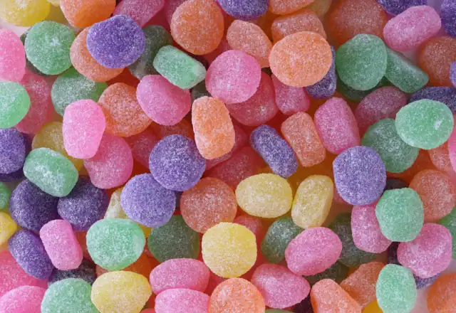 Pile of colorful macarons for kitchen rental for confectionery makers