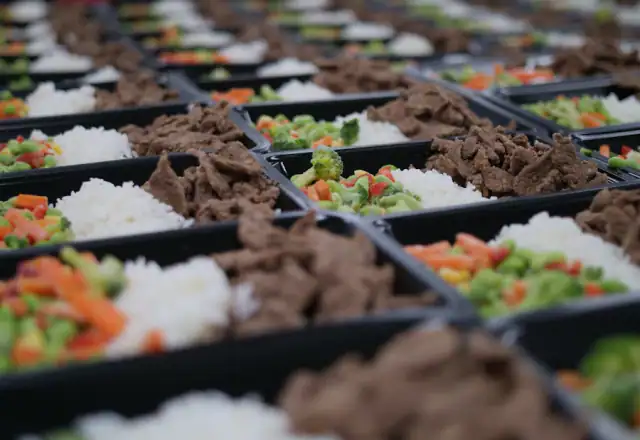 Buffet of prepared food in trays for catering kitchen rental