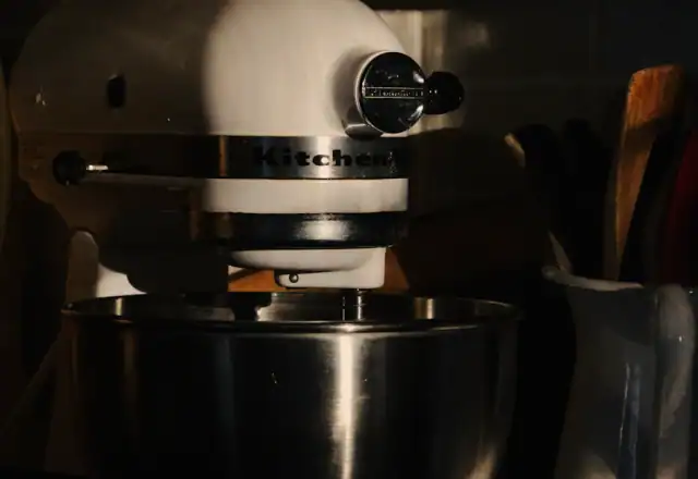 Silver stand mixer on a kitchen counter for equipment and facilities
