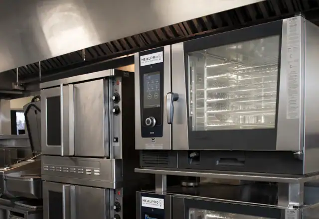 Commercial kitchen filled with stainless steel appliances for kitchen rules and hygiene