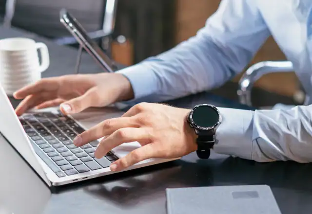 Person typing on a laptop at a desk for how renting works