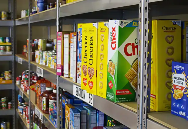 Shelf filled with packaged food for shared kitchen rental