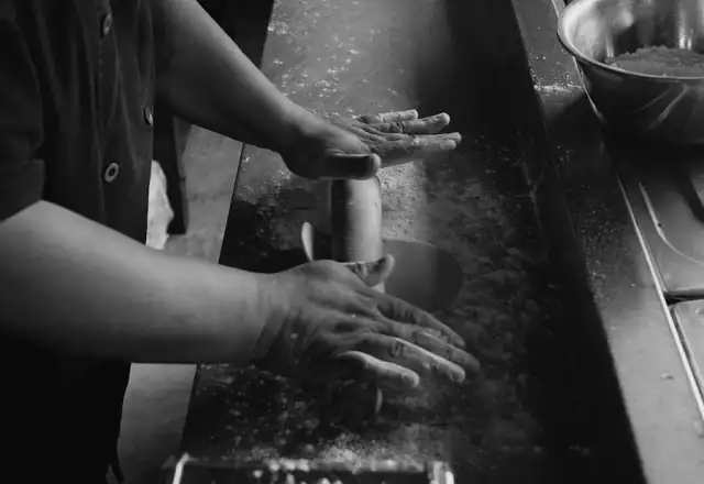 Chef making pasta with a machine for pricing and rental plans