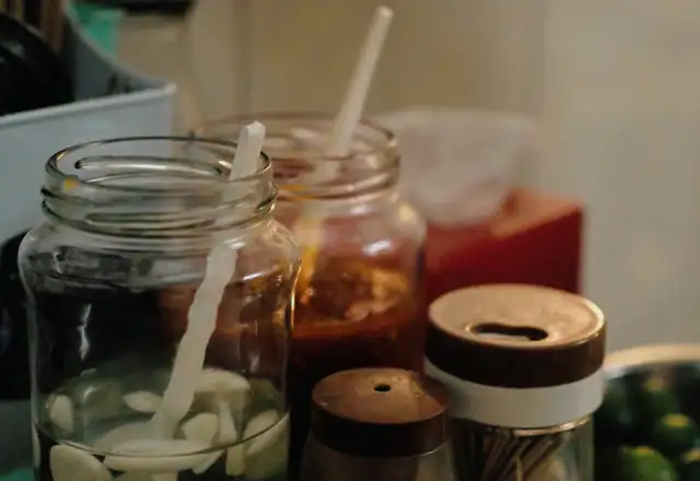 Glass jars of garlic in vinegar and chili sauce for starting a packaged food brand